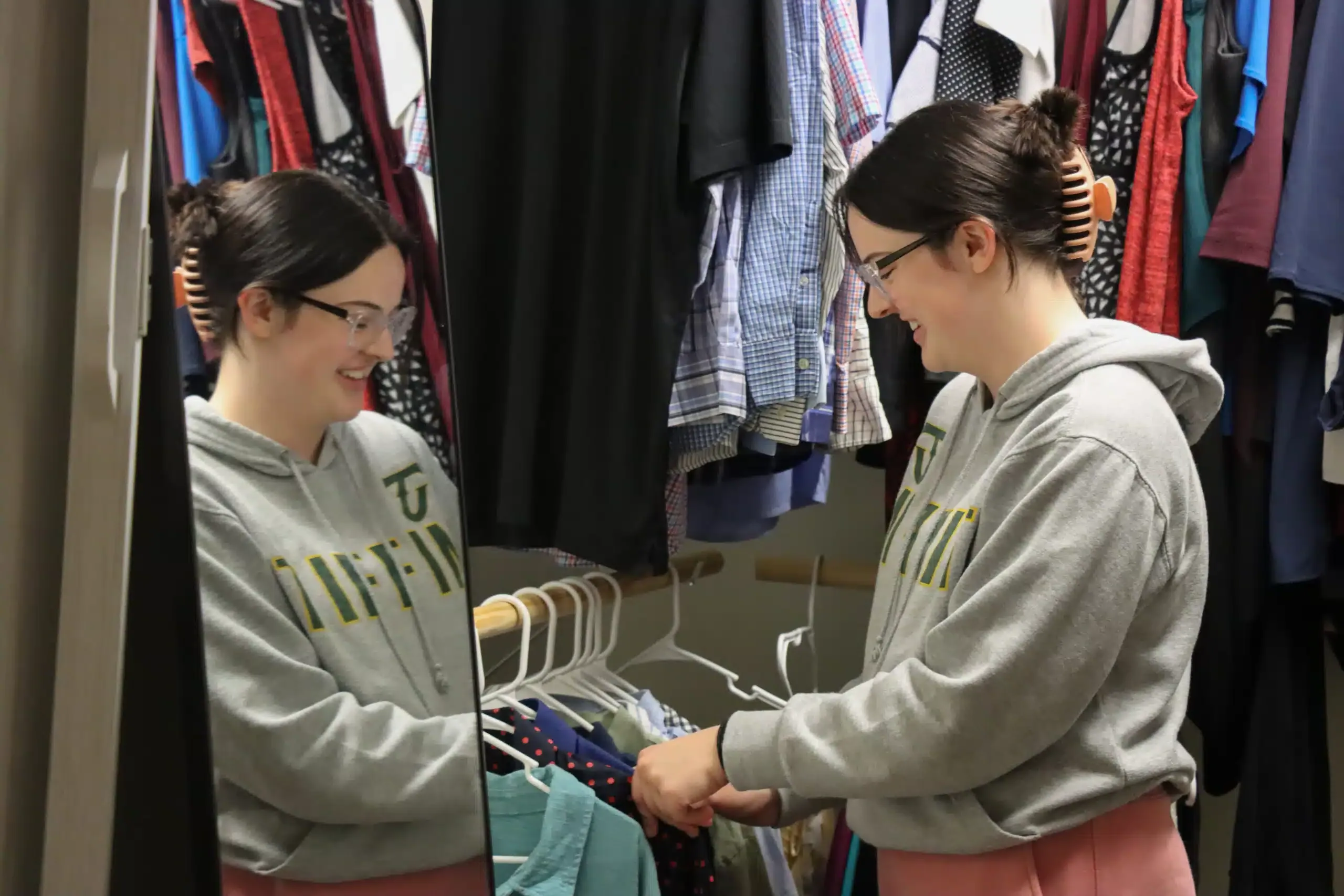 student looking through clothes